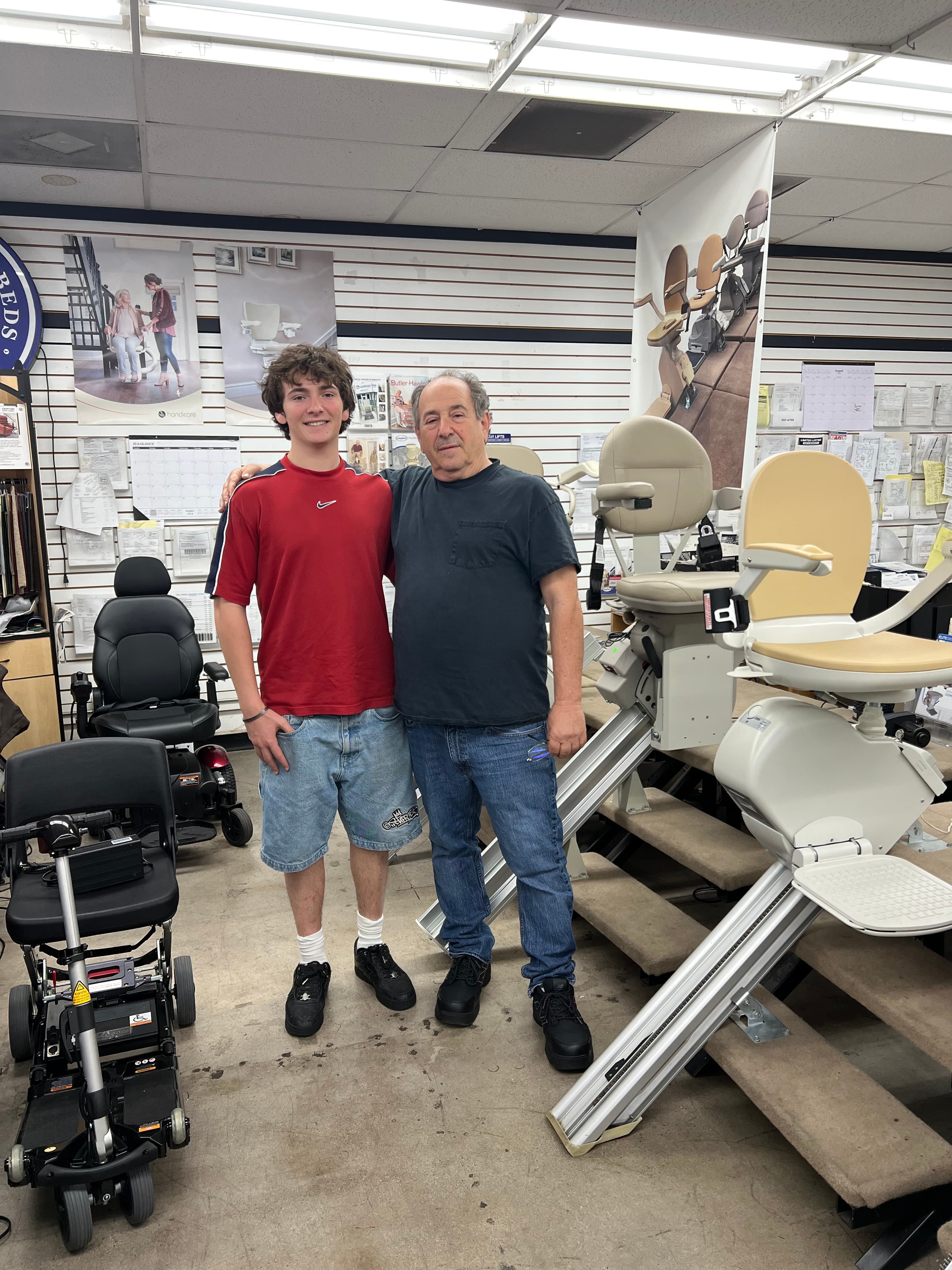 Electropedic family members in the Burbank showroom beside stair lifts and mobility equipment